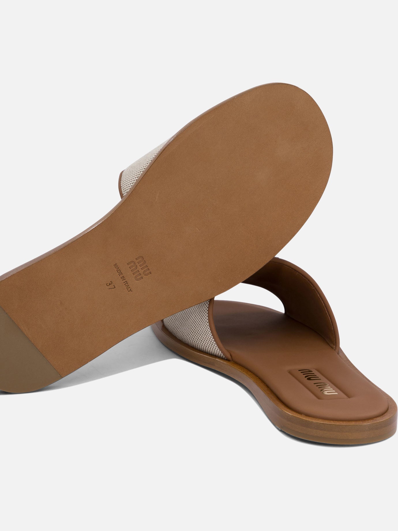 Miu Miu Canvas and leather slides - Women | VIETTI Shop